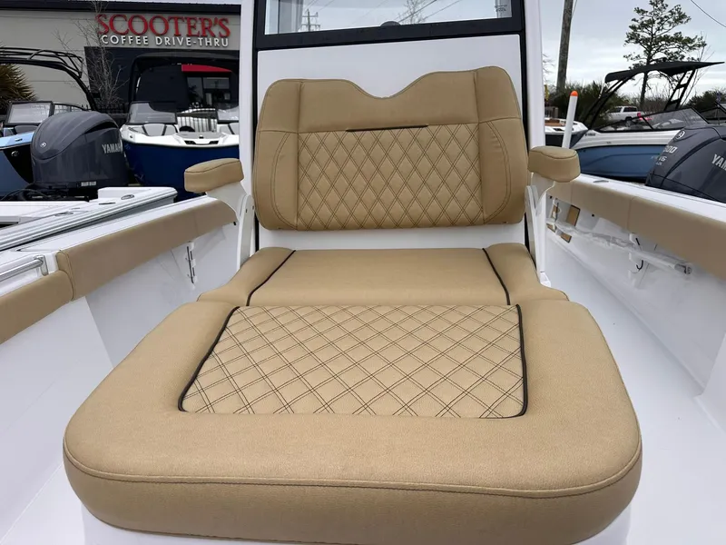 Slide: The Image of 2024 Sportsman Masters 267OE Bay Boat with tan cushioned seating. - 36