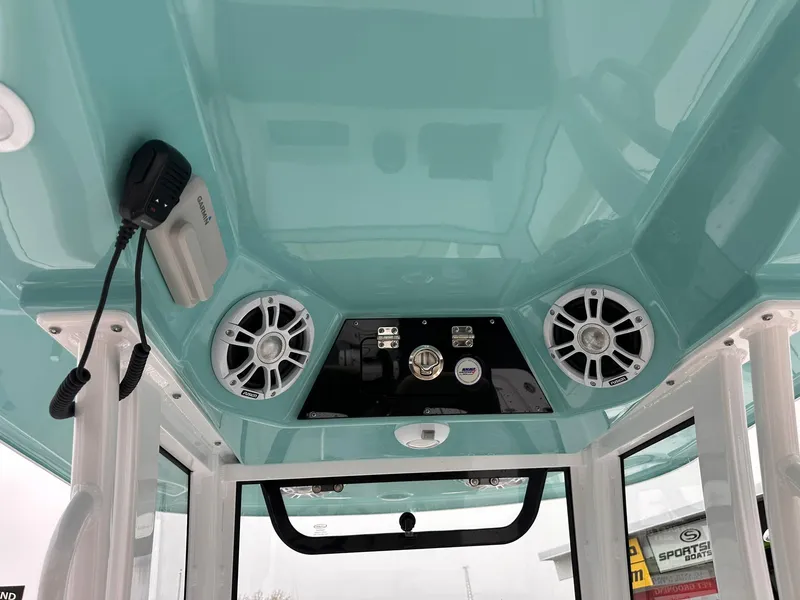 Slide: The Image of 2024 Sportsman Masters 267OE Bay Boat interior with speakers and control panel. - 44