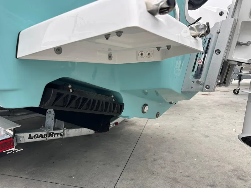 Slide: The Image of 2024 Sportsman Masters 267OE Bay Boat on Load Rite trailer, rear view. - 48