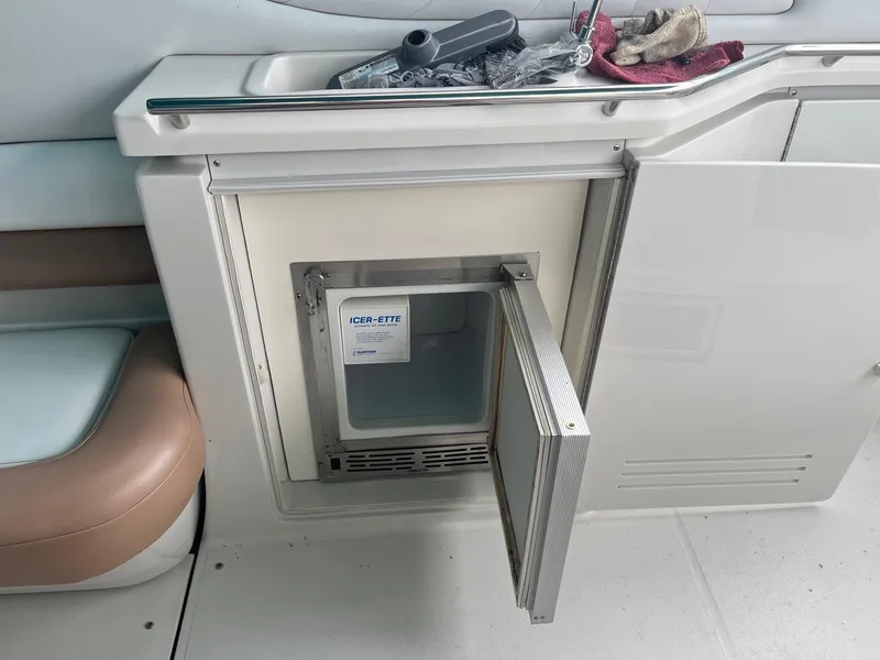 Slide: The Image of Open ice maker on 1993 Regal 9.8 VENTURA boat interior. - 10
