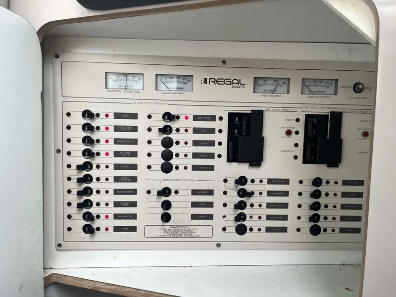 Slide: The Image of 1993 Regal 9.8 VENTURA control panel with switches and gauges. - 11