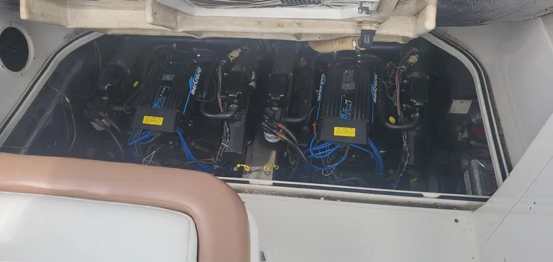 Slide: The Image of Engine compartment of a 1993 Regal 9.8 VENTURA boat, showcasing multiple engines. - 23