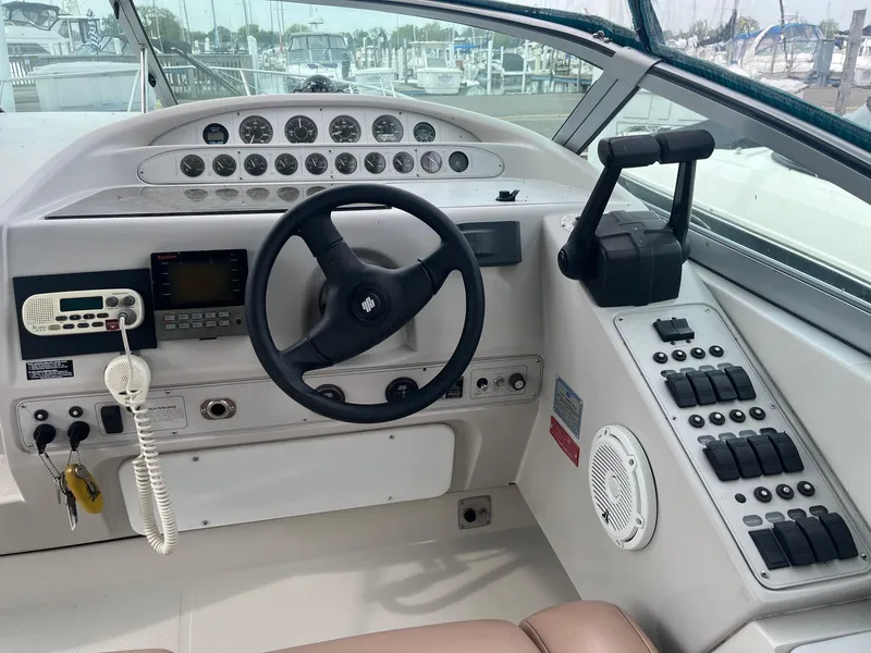 Slide: The Image of Cockpit of 1993 Regal 9.8 VENTURA boat with steering wheel and control panel. - 8
