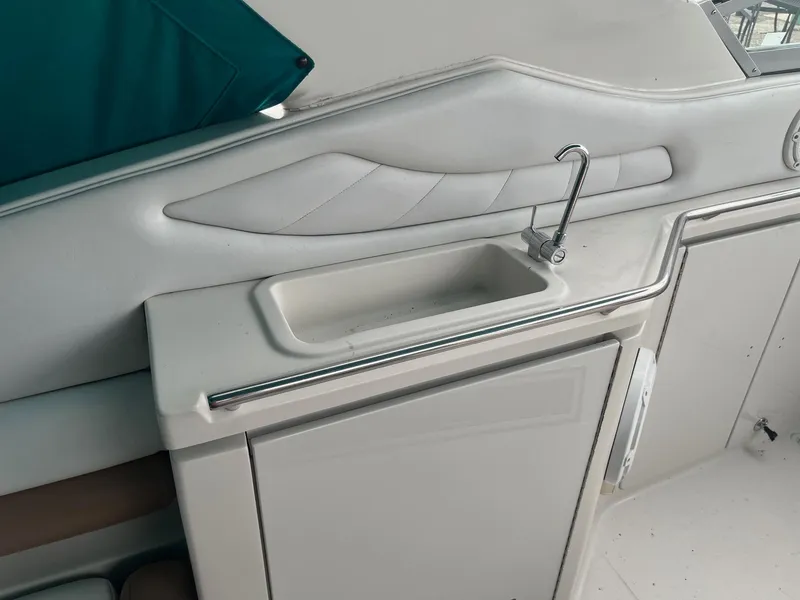 Slide: The Image of Interior of 1993 Regal 9.8 VENTURA boat with sink and storage. - 9