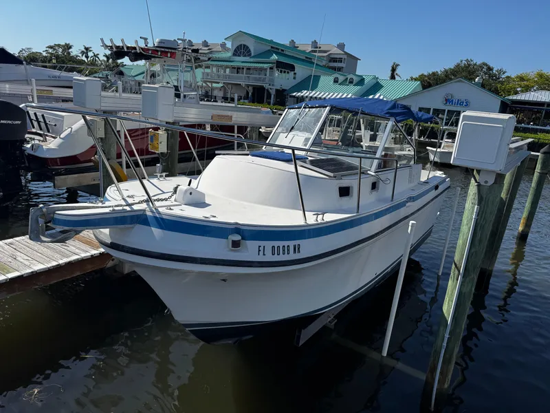 The Image of 2005 Albin 26 Tournament Express boat docked at marina, clear blue sky. - 0