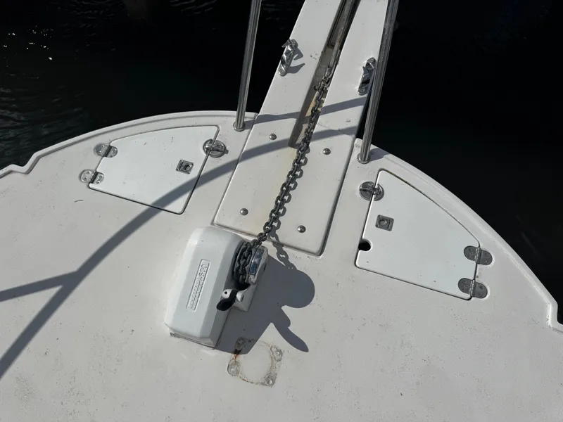 Slide: The Image of Bow of 2005 Albin 26 Tournament Express with anchor chain and winch. - 14