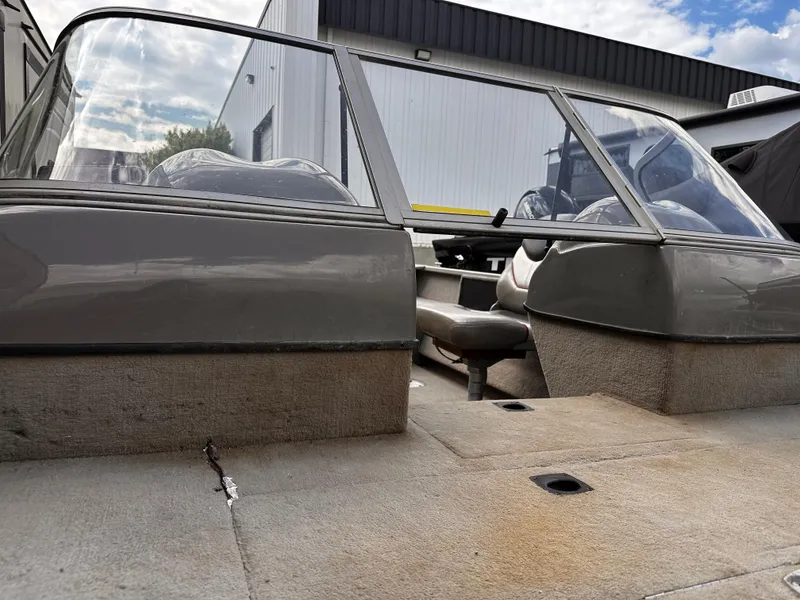 Slide: The Image of 2006 Tracker Pro Guide V-17 WT boat interior with seating and windshield. - 3