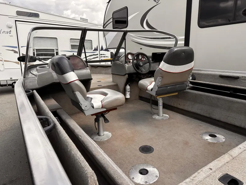 Slide: The Image of 2006 Tracker Pro Guide V-17 WT boat interior with seating and dashboard. - 5