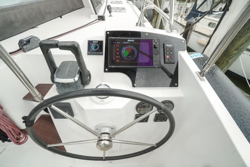 Slide: The Image of Steering console of 2022 Nautitech 40 Open catamaran with navigation equipment. - 11