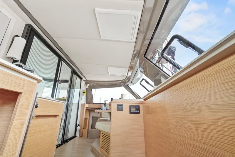 Slide: The Image of Interior of 2022 Nautitech 40 Open catamaran, featuring modern wood finishes and sleek design. - 15