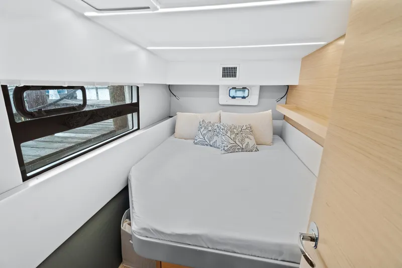 Slide: The Image of Cozy bedroom in 2022 Nautitech 40 Open catamaran with modern design and window view. - 18
