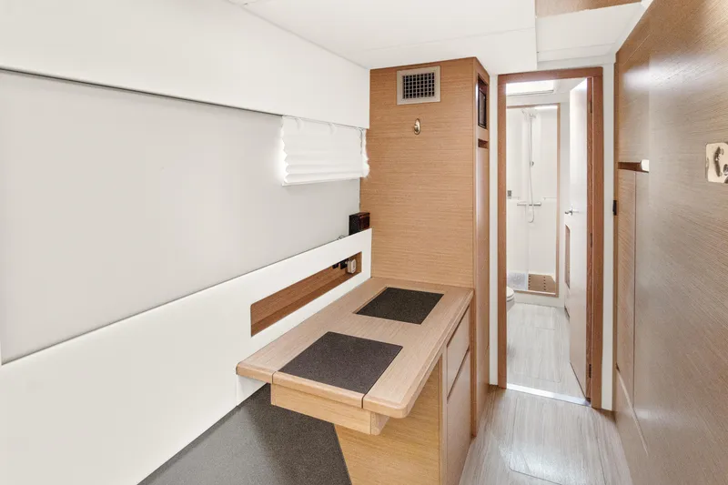 Slide: The Image of Interior of 2022 Nautitech 40 Open yacht, featuring modern wood finish and compact design. - 21