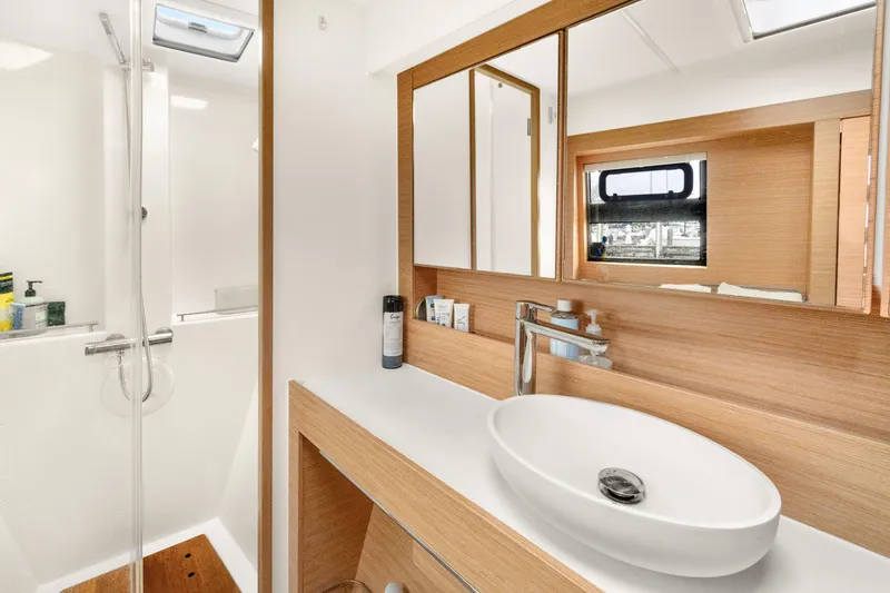 Slide: The Image of Modern bathroom interior on 2022 Nautitech 40 Open catamaran, featuring sleek design and fixtures. - 24
