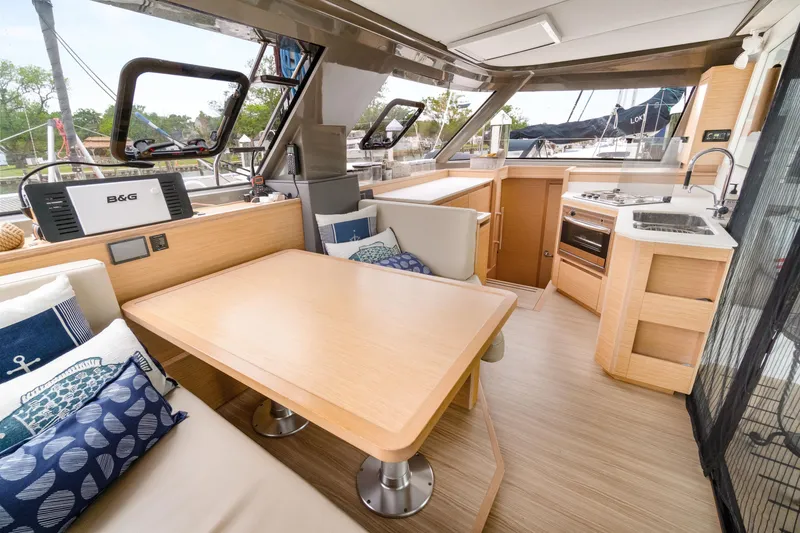 Slide: The Image of Interior of 2022 Nautitech 40 Open catamaran with modern kitchen and dining area. - 31