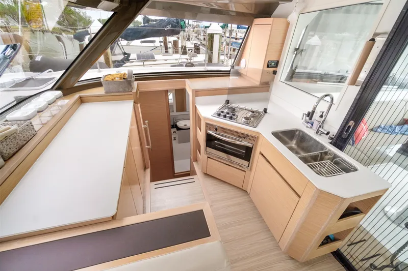 Slide: The Image of Modern kitchen interior of 2022 Nautitech 40 Open catamaran, featuring sleek design and appliances. - 32