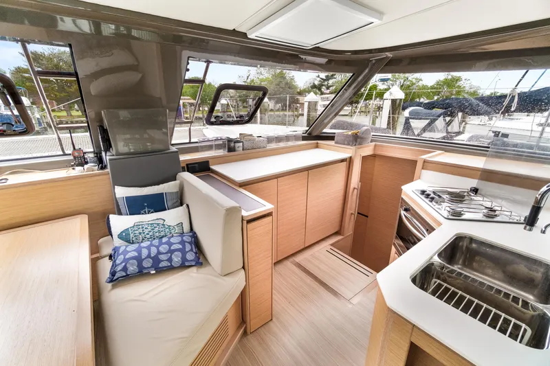 Slide: The Image of Modern interior of 2022 Nautitech 40 Open catamaran with kitchen and seating area. - 34