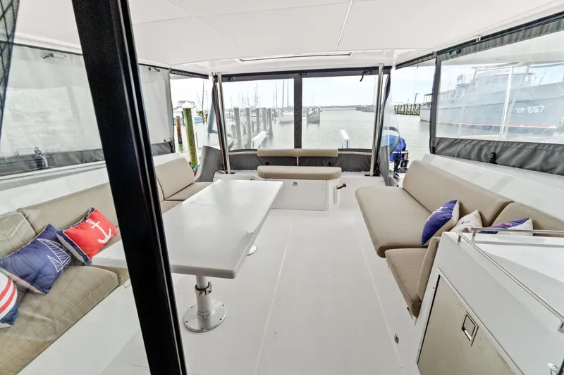Slide: The Image of Interior of 2022 Nautitech 40 Open catamaran with seating and nautical-themed cushions. - 35