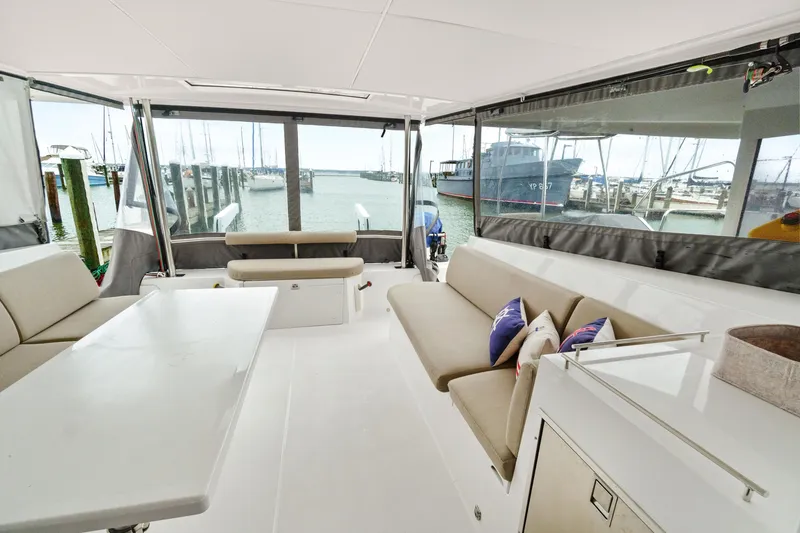Slide: The Image of Spacious interior of 2022 Nautitech 40 Open catamaran with comfortable seating and marina view. - 36