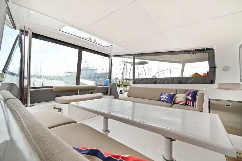 Slide: The Image of Interior of 2022 Nautitech 40 Open catamaran with spacious seating and nautical-themed cushions. - 37