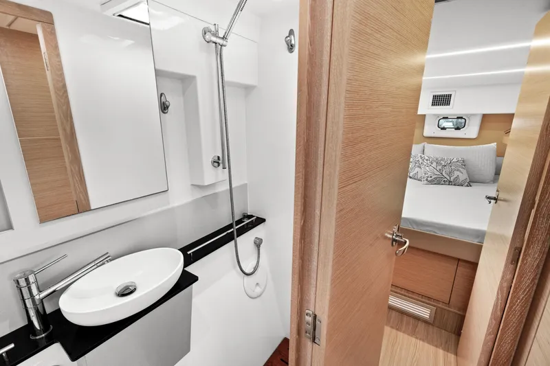 Slide: The Image of Modern bathroom and bedroom interior on a 2022 Nautitech 40 Open catamaran. - 38