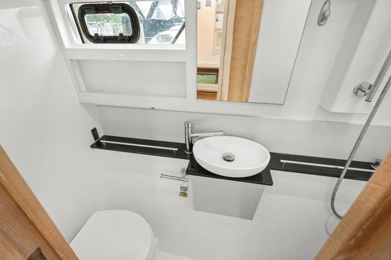 Slide: The Image of Modern bathroom in 2022 Nautitech 40 Open yacht with sleek fixtures and window. - 40