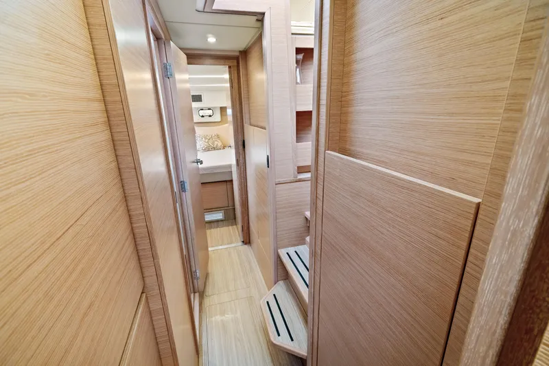 Slide: The Image of Nautitech 40 Open 2022 interior hallway with wooden finish and steps. - 42