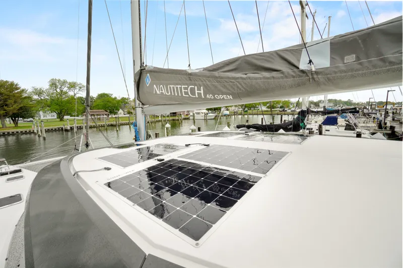 Slide: The Image of 2022 Nautitech 40 Open catamaran with solar panels docked at marina. - 47