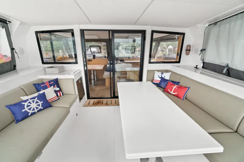 Slide: The Image of Spacious interior of 2022 Nautitech 40 Open catamaran with nautical-themed cushions. - 8