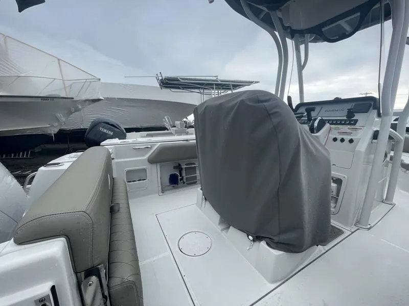 Slide: The Image of 2023 Finseeker 210 FS.2 boat interior with covered helm and seating. - 4