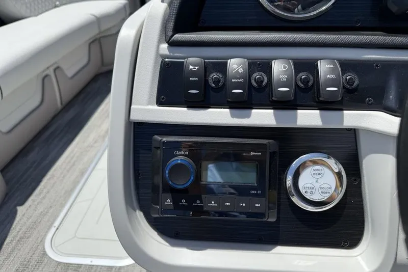 Slide: The Image of Control panel of 2025 Godfrey Sweetwater 2286 SB boat with buttons and audio system. - 10