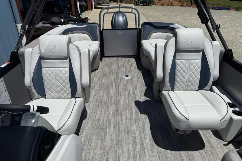 Slide: The Image of Luxurious interior of 2025 Godfrey Sweetwater 2286 SB pontoon boat with plush seating. - 12