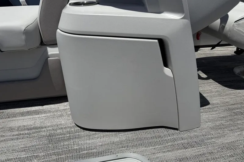 Slide: The Image of 2025 Godfrey Sweetwater 2286 SB boat interior with gray seating and flooring. - 16