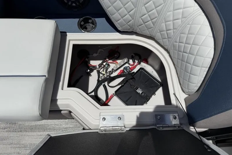 Slide: The Image of Storage compartment of 2025 Godfrey Sweetwater 2286 SB boat, featuring wiring and battery setup. - 23