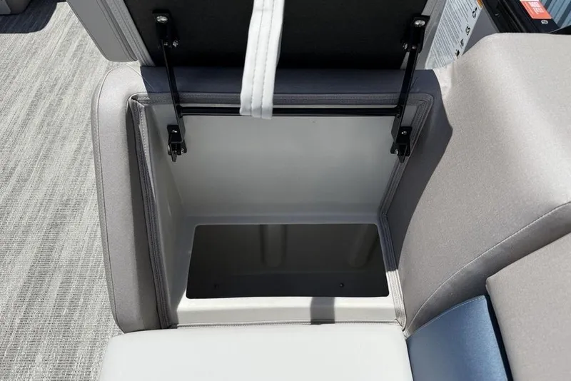 Slide: The Image of Open storage compartment in 2025 Godfrey Sweetwater 2286 SB boat, showcasing interior space. - 25
