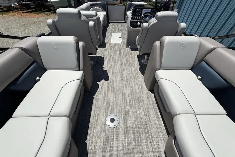 Slide: The Image of 2025 Godfrey Sweetwater 2286 SB boat interior with plush seating and modern dashboard. - 34