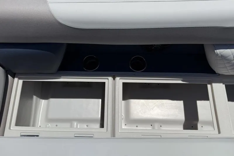 Slide: The Image of Interior storage compartments of 2025 Godfrey Sweetwater 2286 SB boat with cup holders. - 5