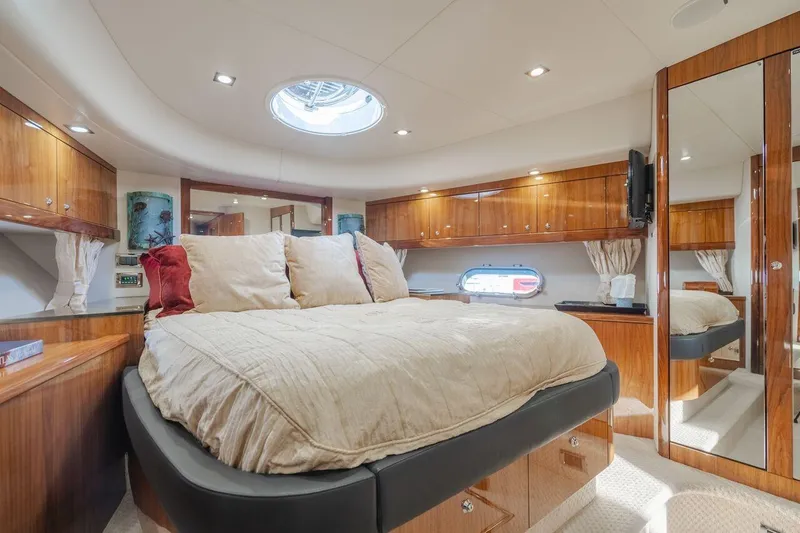 Slide: The Image of Luxurious bedroom interior of 2010 Sunseeker Manhattan 60 yacht with elegant wood finishes. - 18