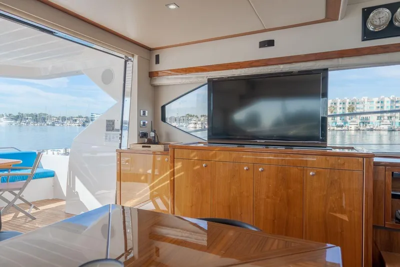 Slide: The Image of Luxurious interior of 2010 Sunseeker Manhattan 60 yacht with TV and marina view. - 31