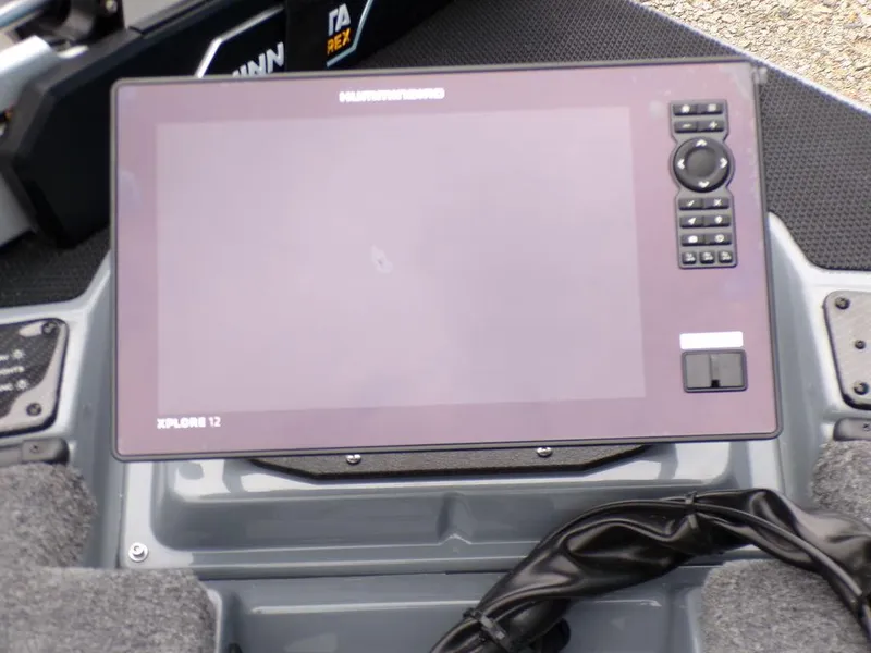 Slide: The Image of 2025 Phoenix 921 ELITE boat dashboard with Humminbird Xplore 12 display. - 13