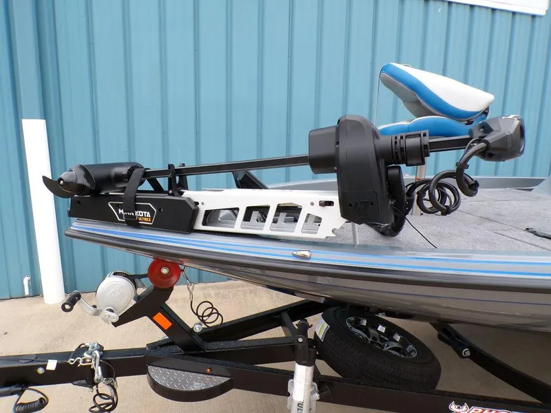 Slide: The Image of 2025 Phoenix 921 ELITE boat with Minn Kota trolling motor, blue and gray design. - 16