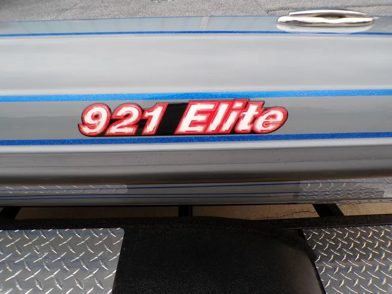 Slide: The Image of 2025 Phoenix 921 Elite boat logo on metallic surface with diamond plate detail. - 19