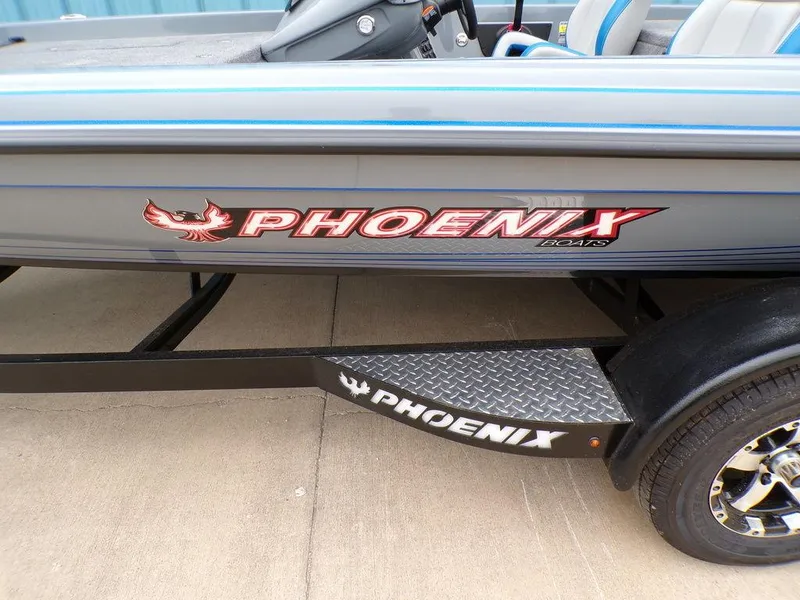 Slide: The Image of 2025 Phoenix 921 ELITE boat with logo and trailer detail. - 20