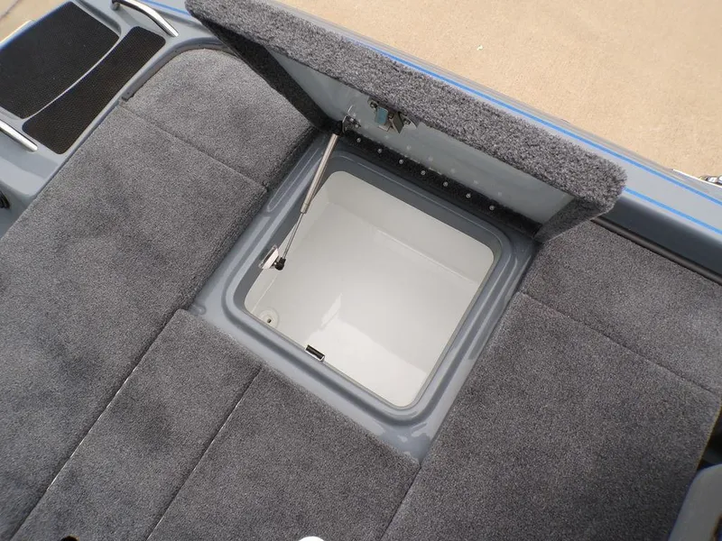 Slide: The Image of 2025 Phoenix 921 ELITE boat storage compartment with open lid, showcasing interior space. - 24