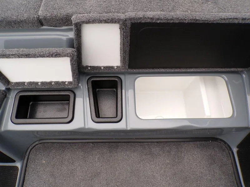 Slide: The Image of 2025 Phoenix 921 ELITE boat storage compartments with carpeted interior and multiple sections. - 3