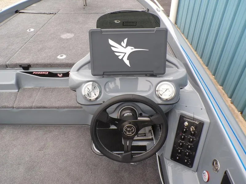 Slide: The Image of Steering console of 2025 Phoenix 921 ELITE boat with gauges and control panel. - 5
