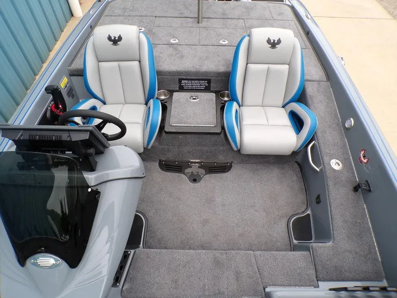 Slide: The Image of 2025 Phoenix 921 ELITE boat interior with two seats and steering console. - 7