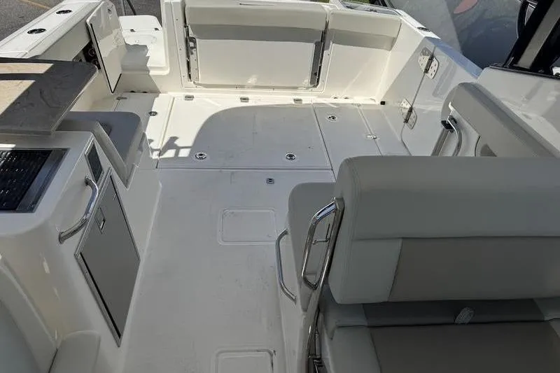 Slide: The Image of 2025 Boston Whaler 280 Vantage boat interior with spacious seating and sleek design. - 12