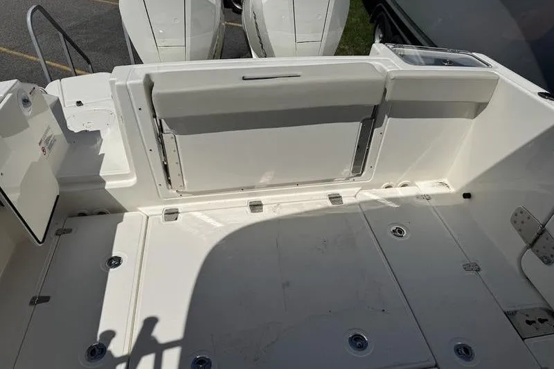 Slide: The Image of 2025 Boston Whaler 280 Vantage boat deck with seating and storage compartments. - 7