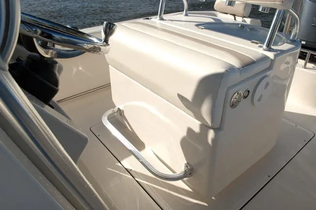 Slide: The Image of 2019 Pioneer 222 Sportfish boat interior with seating and steering wheel. - 18