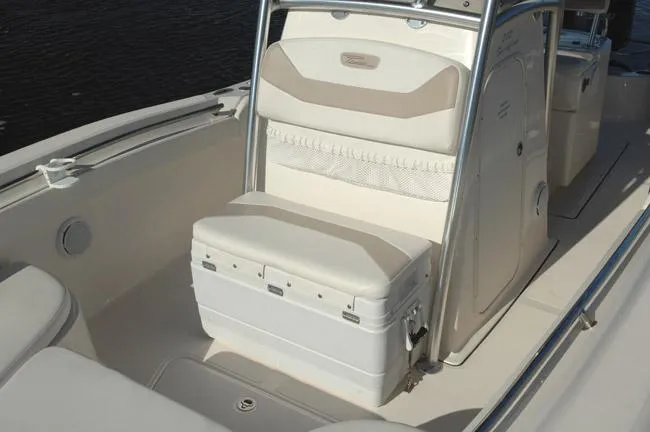 Slide: The Image of 2019 Pioneer 222 Sportfish boat interior with cushioned seating and storage. - 19